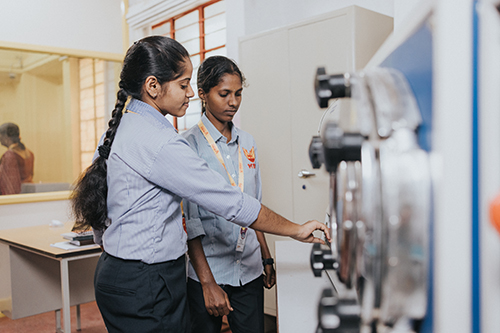B.Tech Electronics and Communication Engineering students learning with advanced machinery